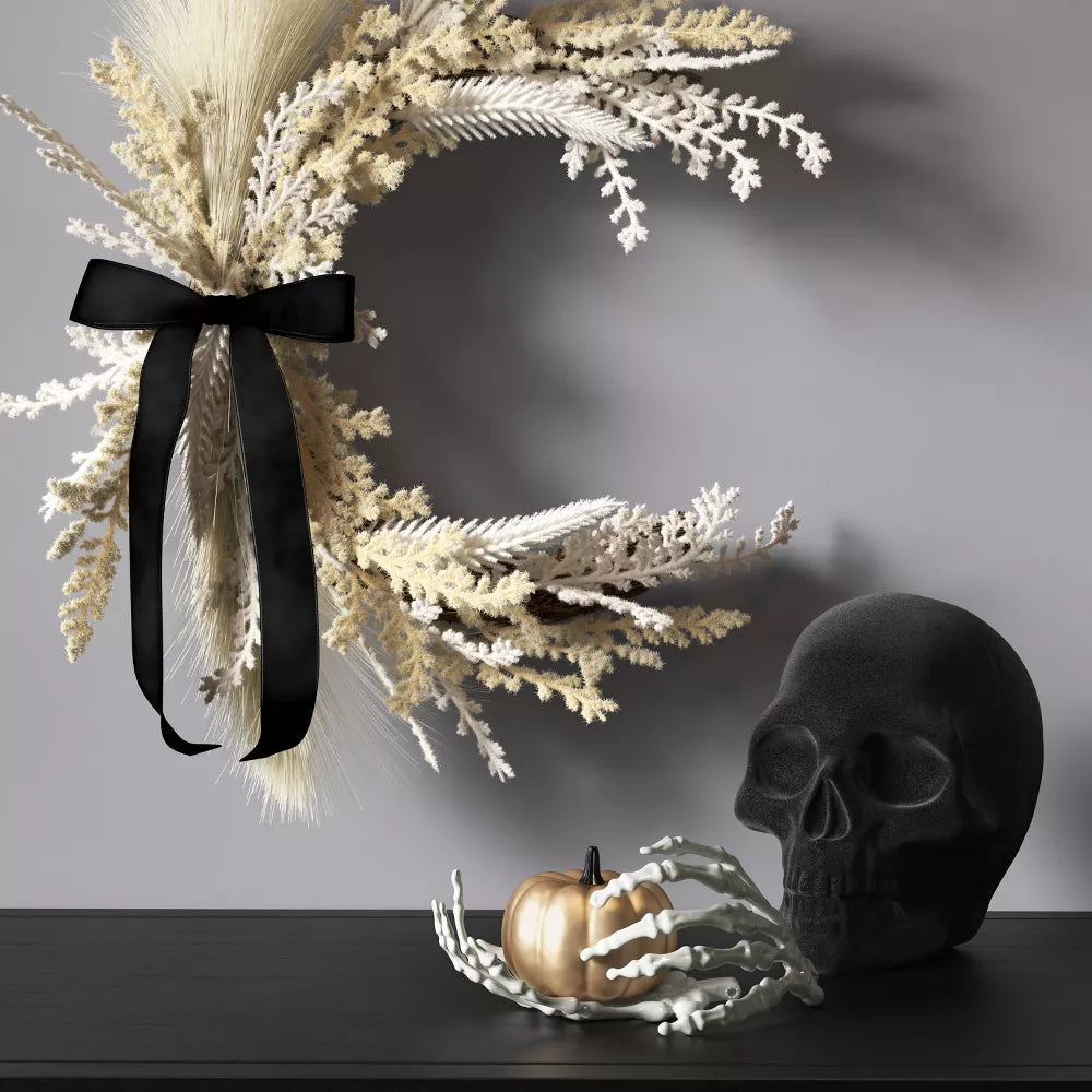 PLASTIC FLOCKING SKULL FIGURINE
